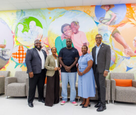 From left, Rodney D. Bain Jr., deputy superintendent of insurance at the Insurance Commission of The Bahamas; Dana Munnings-Gray, superintendent of insurance; Bahamian artist Allan Pachino Wallace, DeAndrea Lewis, vice president, life operations and sales at Colina; and Marcus Bosland, chief operating officer, Colina; pose in front of a mural commissioned by Colina for the Southwest Plaza branch.