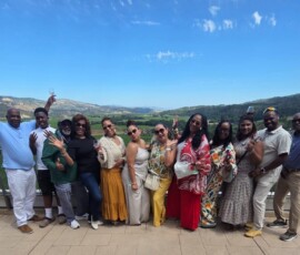 The group gathers for a photo at one of their tours.