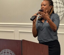 Latasha Strachan, senior manager, learning and development at Colina, interacts with the students.
