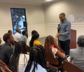 Brian Williams, co-founder and chief executive officer of Indigo Insurance (Bahamas) Limited, speaks with the BYLD participants.