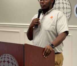 Javon Pinder, information technology service and support technician at Colina, speaks to the students.
